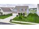Attractive home showcasing lush landscaping, and an attached two car garage at 14878 Anees Ln, Fishers, IN 46040