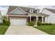 Beautiful single-Gathering home featuring a brick facade, a two-car garage, and a well-maintained yard at 14878 Anees Ln, Fishers, IN 46040