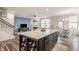 Spacious kitchen with a center island, dining area, and seamless flow into the living space at 14878 Anees Ln, Fishers, IN 46040