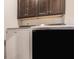 Bright laundry room with modern washer and dryer, complemented by upper cabinets for storage at 14878 Anees Ln, Fishers, IN 46040