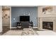 Inviting living room with a fireplace, TV, and stylish decor, perfect for entertaining at 14878 Anees Ln, Fishers, IN 46040