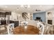 Open concept living space with dining area, kitchen, and a glimpse of the living room fireplace at 14878 Anees Ln, Fishers, IN 46040