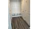 Welcoming mudroom featuring a built-in bench, hooks, cubbies, and durable laminate flooring at 14878 Anees Ln, Fishers, IN 46040
