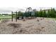 Playground with slides, swings, and a climbing structure set in a wooded area with engineered wood fiber at 14878 Anees Ln, Fishers, IN 46040