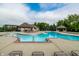 Community pool with lounge chairs, gazebo, and ample space for relaxation at 14878 Anees Ln, Fishers, IN 46040