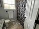 Well-lit bathroom with a shower featuring modern design and attractive decor at 1502 Austin Dr, Lebanon, IN 46052