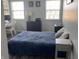 Bedroom featuring a blue duvet, a white desk and two windows at 1502 Austin Dr, Lebanon, IN 46052