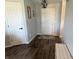 Inviting entryway features new hardwood flooring, modern decor, and white painted doors at 1502 Austin Dr, Lebanon, IN 46052