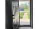 View of the front yard through an open front door and screen at 1502 Austin Dr, Lebanon, IN 46052