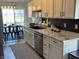 Modern kitchen with stainless steel appliances, white cabinets and marble countertops at 1502 Austin Dr, Lebanon, IN 46052