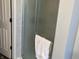 Shower featuring glass doors, marbled tile, and a towel bar, offering style and functionality to the space at 1502 Austin Dr, Lebanon, IN 46052