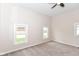 Bright bedroom with neutral paint, carpet flooring, and natural light from windows at 1523 S K St, Elwood, IN 46036