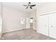 Spacious bedroom featuring carpet, a ceiling fan, and a walk-in closet at 1523 S K St, Elwood, IN 46036