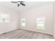 Light-filled bedroom with carpet flooring, ceiling fan, and ample natural light at 1523 S K St, Elwood, IN 46036