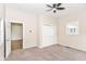 Cozy bedroom with neutral walls, closet, carpet flooring, and a ceiling fan at 1523 S K St, Elwood, IN 46036