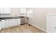 Modern kitchen featuring stainless steel appliances, white cabinets, and sleek countertops at 1523 S K St, Elwood, IN 46036