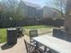 This backyard features a spacious patio with an outdoor dining set, perfect for entertaining and outdoor dining at 15406 Destination Dr, Noblesville, IN 46060