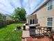 Lovely backyard patio featuring a grill, table and chairs, fire pit, and a green lawn at 15406 Destination Dr, Noblesville, IN 46060