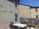 This backyard features a patio with a dining table set, lights, and a grill, ideal for outdoor entertaining at 15406 Destination Dr, Noblesville, IN 46060