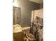 The bathroom is equipped with a tub and a shower curtain with a barn and cow pattern at 15406 Destination Dr, Noblesville, IN 46060