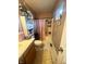 Narrow bathroom featuring marble tile floor, pink shower curtain, and white fixtures at 15406 Destination Dr, Noblesville, IN 46060