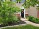 Charming home exterior featuring a welcoming front door with wreath and landscaped garden at 15406 Destination Dr, Noblesville, IN 46060