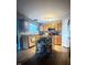 Well-equipped kitchen with wooden cabinets, modern appliances, island cart and wood-look flooring at 15406 Destination Dr, Noblesville, IN 46060