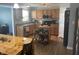 Bright kitchen with wood cabinets, central island, modern appliances and wood plank flooring at 15406 Destination Dr, Noblesville, IN 46060