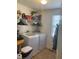 Convenient laundry room with washer and dryer, shelving, and storage space near a window at 15406 Destination Dr, Noblesville, IN 46060