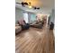 Cozy living room featuring new wood floors and ceiling fan at 15406 Destination Dr, Noblesville, IN 46060