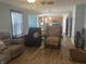 Comfortable living room with an open plan into the kitchen, wood floors and ample seating at 15406 Destination Dr, Noblesville, IN 46060