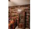 Rustic living room featuring wood-paneled wall and a vintage wooden display cabinet at 15406 Destination Dr, Noblesville, IN 46060
