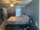 Stylish main bedroom featuring a ceiling fan, neutral walls, and a beautiful bay window at 15406 Destination Dr, Noblesville, IN 46060