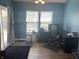 Comfortable office space with wood floors, neutral paint and large windows that bring in natural light at 15406 Destination Dr, Noblesville, IN 46060
