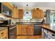 Bright kitchen featuring custom wood cabinets, granite countertops, and stainless steel appliances at 1630 N 400 W, Bargersville, IN 46106