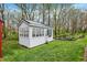 Outbuilding featuring multiple windows, a flower box, and a well-kept lawn at 1630 N 400 W, Bargersville, IN 46106
