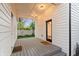 Cozy back porch with outdoor lighting, perfect for relaxing and entertaining at 2044 Alvord St, Indianapolis, IN 46202
