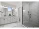 Elegant bathroom featuring a glass-enclosed shower and double vanity at 2044 Alvord St, Indianapolis, IN 46202