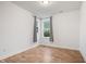 Well-lit bedroom features warm-toned floors, two windows, and neutral paint at 2044 Alvord St, Indianapolis, IN 46202