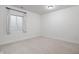Clean bedroom with a window and plush carpeted flooring at 2044 Alvord St, Indianapolis, IN 46202