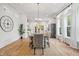 Elegant dining room with ample windows, modern chandelier, and stylish decor at 2044 Alvord St, Indianapolis, IN 46202