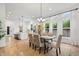 Bright dining room boasts a large table, natural light, and open-concept design leading into the kitchen at 2044 Alvord St, Indianapolis, IN 46202