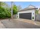 Spacious two-car garage with a dark gray door, offering convenient parking and storage at 2044 Alvord St, Indianapolis, IN 46202