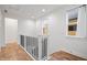 Upstairs hallway featuring wood floors and white trim at 2044 Alvord St, Indianapolis, IN 46202