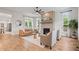 Stylish living room boasts a brick fireplace, hardwood floors, and modern furnishings at 2044 Alvord St, Indianapolis, IN 46202