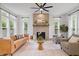 Elegant living room with brick fireplace, stylish furniture, and neutral decor at 2044 Alvord St, Indianapolis, IN 46202