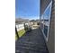 Inviting wooden deck, complemented by well-manicured grass, offering an ideal outdoor retreat at 2068 Deer Valley Ct, Columbus, IN 47201
