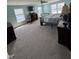 Spacious bedroom with natural light, ceiling fan, and comfortable furnishings at 2068 Deer Valley Ct, Columbus, IN 47201