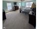 Spacious bedroom with natural light, ceiling fan, and comfortable furnishings at 2068 Deer Valley Ct, Columbus, IN 47201