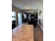 Open-concept dining area with hardwood floors leading into a living room with ample natural light at 2068 Deer Valley Ct, Columbus, IN 47201